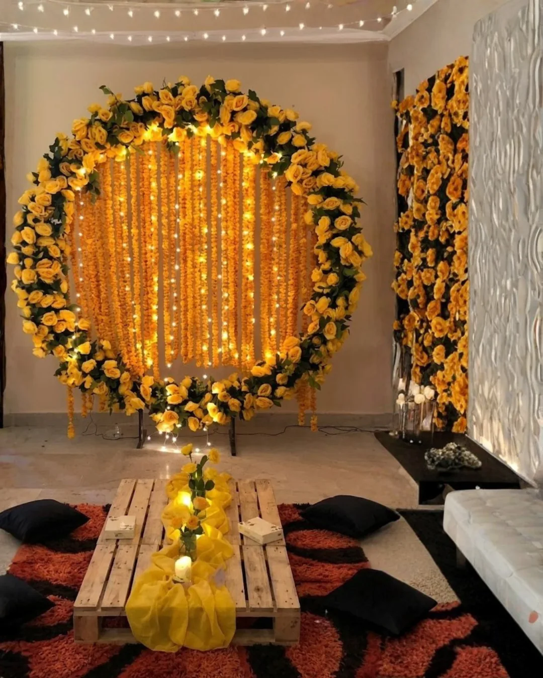 Round yellow floral backdrop with warm lights in a home setting